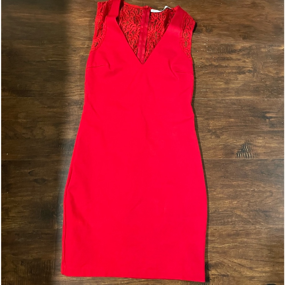 Red dress with lace back and on the shoulder.